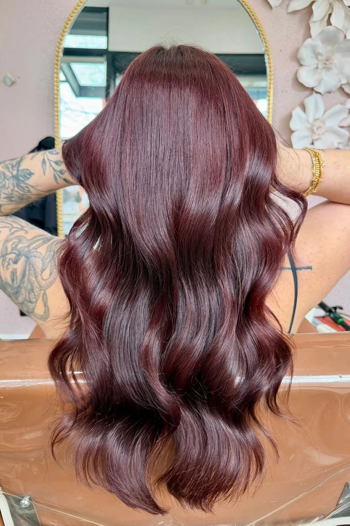 Glossy burgundy colour refresh with polished waves